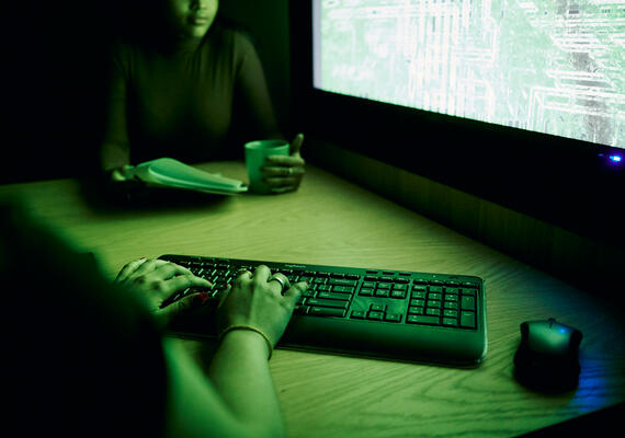 Students in front of a large computer screen