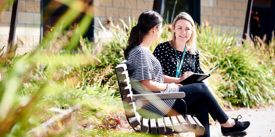 Two students talking in a social work setting