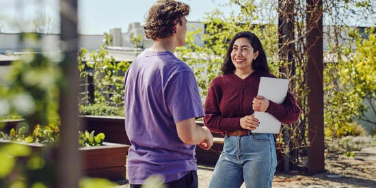 Two students talking in a campus garden at Waurn Ponds.