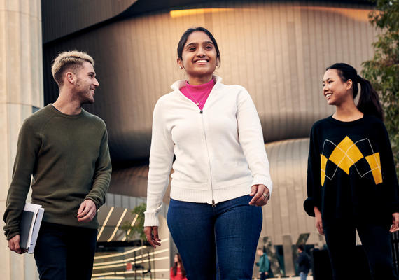 Three students walking on Deakin Burwood Campus