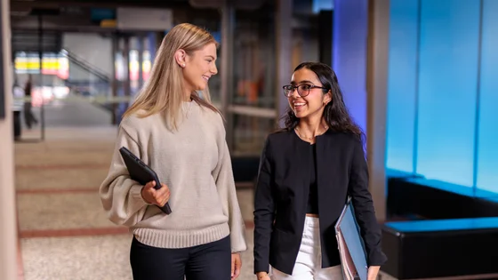 Two students walking on the Deakin Waterfront campus.