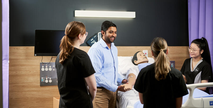Group of students with a nursing simulation model