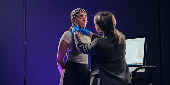 Two people using an EEG.
