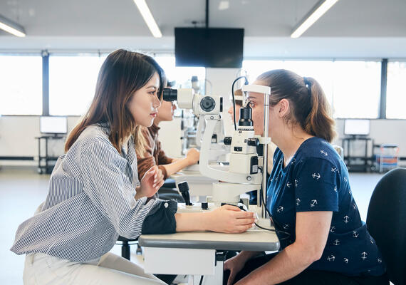 A student examining an optometry patient.