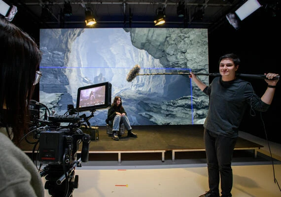 Two students at Deakin Virtual Production Studios (Burwood) - one holds a camera while the other holds the boom