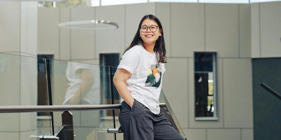 High school student on campus at Deakin smiling.