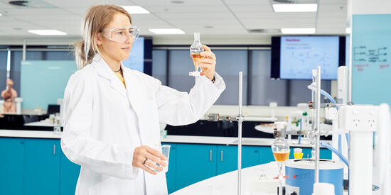 Person holding up tester in lab
