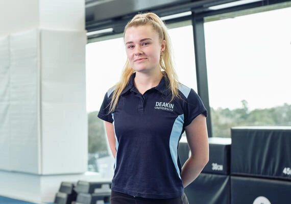 Person facing the camera smiling in exercise science lab