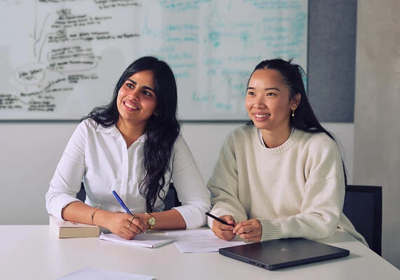 Two Deakin students studying in a classroom