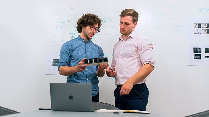Two researchers discussing prototype