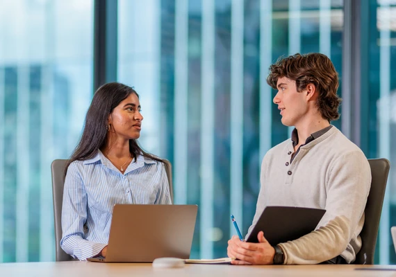 Two Deakin business students study together