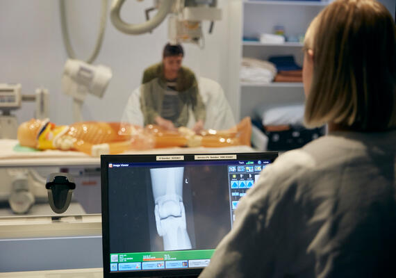 A student using medical imaging equipment
