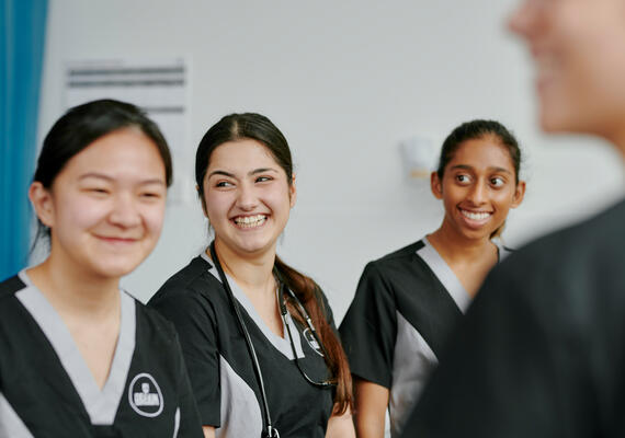Three midwifery students smiling