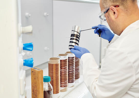 A Deakin science researcher with beakers