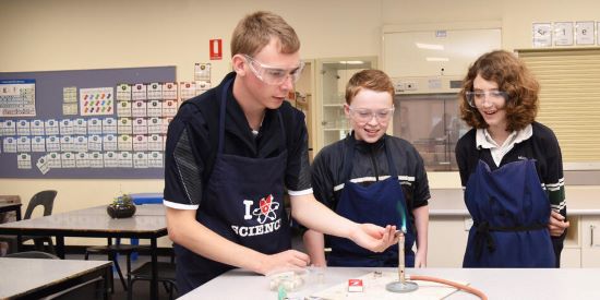 Secondary school science teacher teaching in a laboratory.