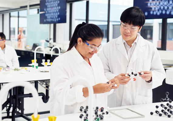 Two biological science students in a lab.