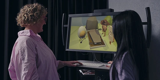 A Deakin design student and lecturer working on an animation