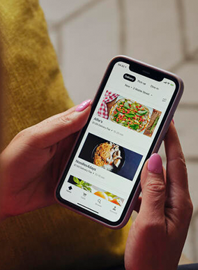 A person uses an app on their phone.