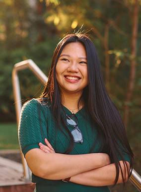 A Deakin international student smiles at the camera