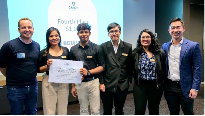 Group of 6 people smiling with certificate