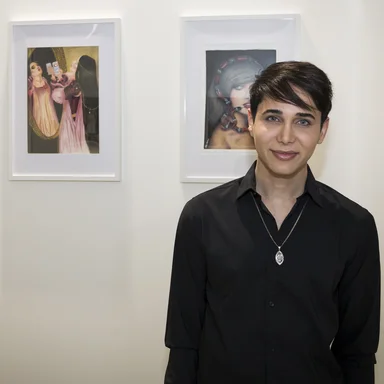 Alex in front of artworks