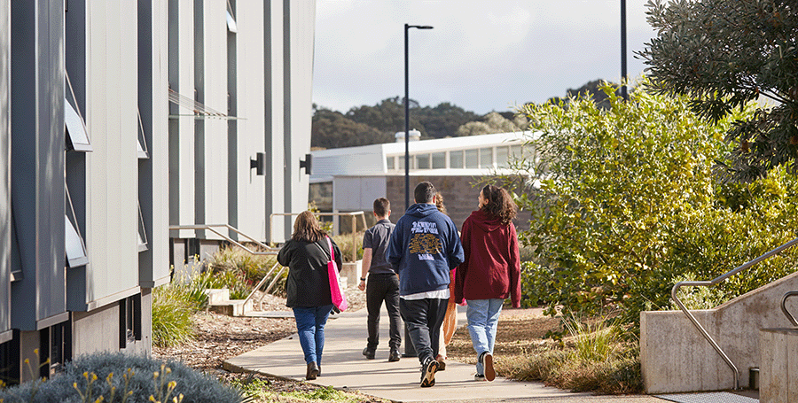 Students passing a building