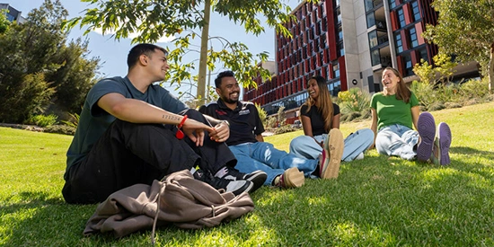 Happy students on a lawn