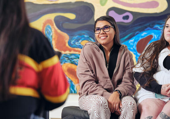 A Deakin student talks to another student at the NIKERI Institute. 