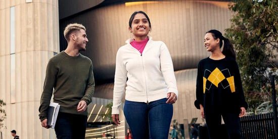 Three students walking on Deakin Burwood Campus