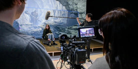 A group of students working and filming at Deakin Virtual Production Studios in Burwood.