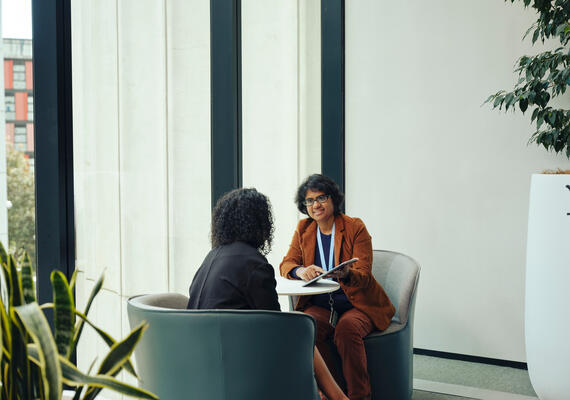 An interviewer and an interviewee sitting and talking