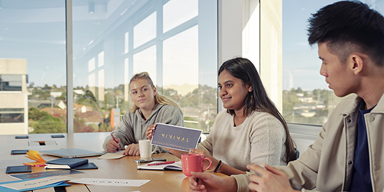 Deakin business students working collaboratively