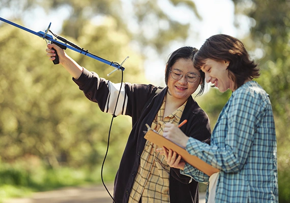 Two environmental engineering students using a radio tracking device