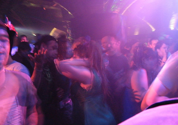 People dancing inside dark nightclub