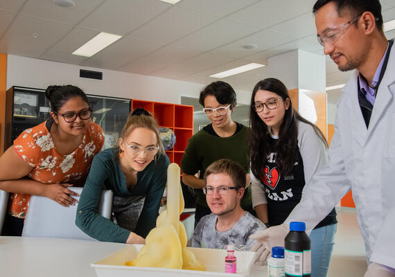 Students and a teacher perform a science experiment in an education secondary science class activity at Deakin's Melbourne Burwood Campus.