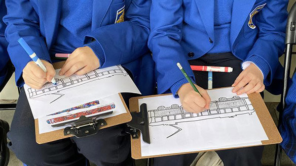 Students from Emmaus College, inspired by Terry Matassoni's Art Tram 837 create their own Art Tram designs at the Burwood campus during a Schools Program, 2025. Photo by Tabitha Davies.