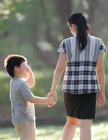 Parent and child holding hands