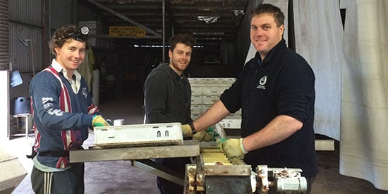 Deakin graduates Joe Holt, Tim Carew and Lachlan Hulands, working on a grader at SOM