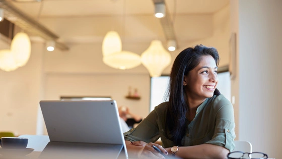Person smiles while in a coworking space