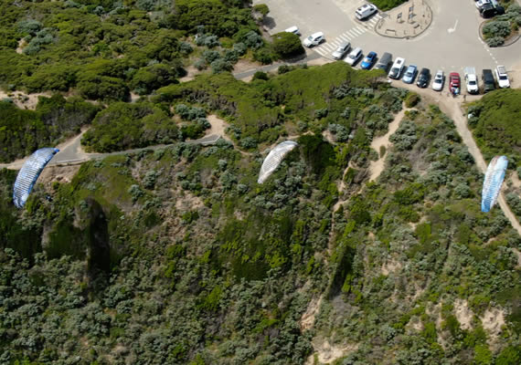 Aerial view of art event at beach carpark.