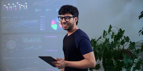 Business research student holding ipad.