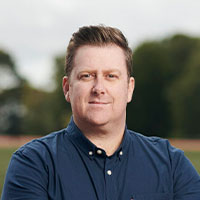 A headshot of Luke Bryden smiling at the camera.