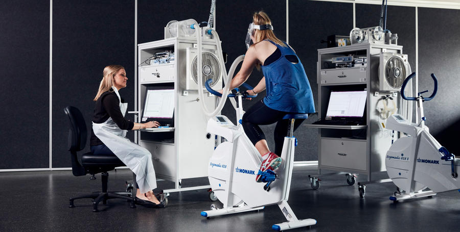 Deakin student stationary cycling in a Deakin campus sport facility for a test.