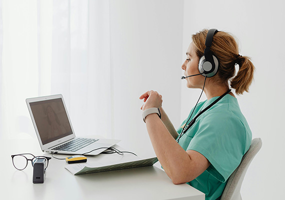 A midwife conducts a telehealth appointment.