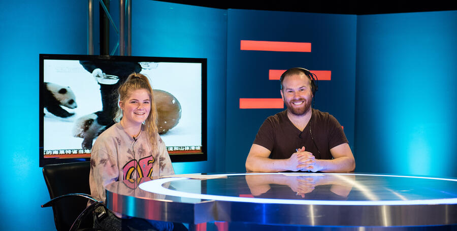 Deakin students presenting in the TV studio