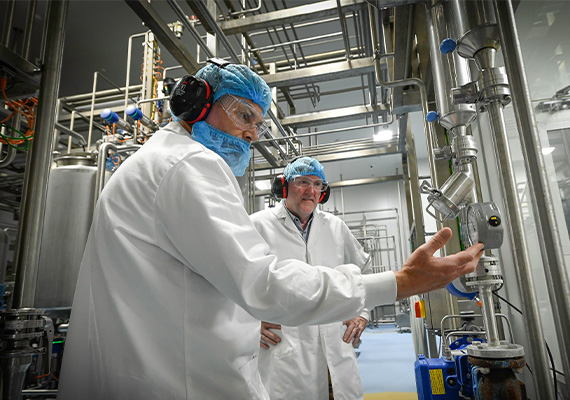 Deakin researcher and industry partner in Bellarine Foods manufacturing plant