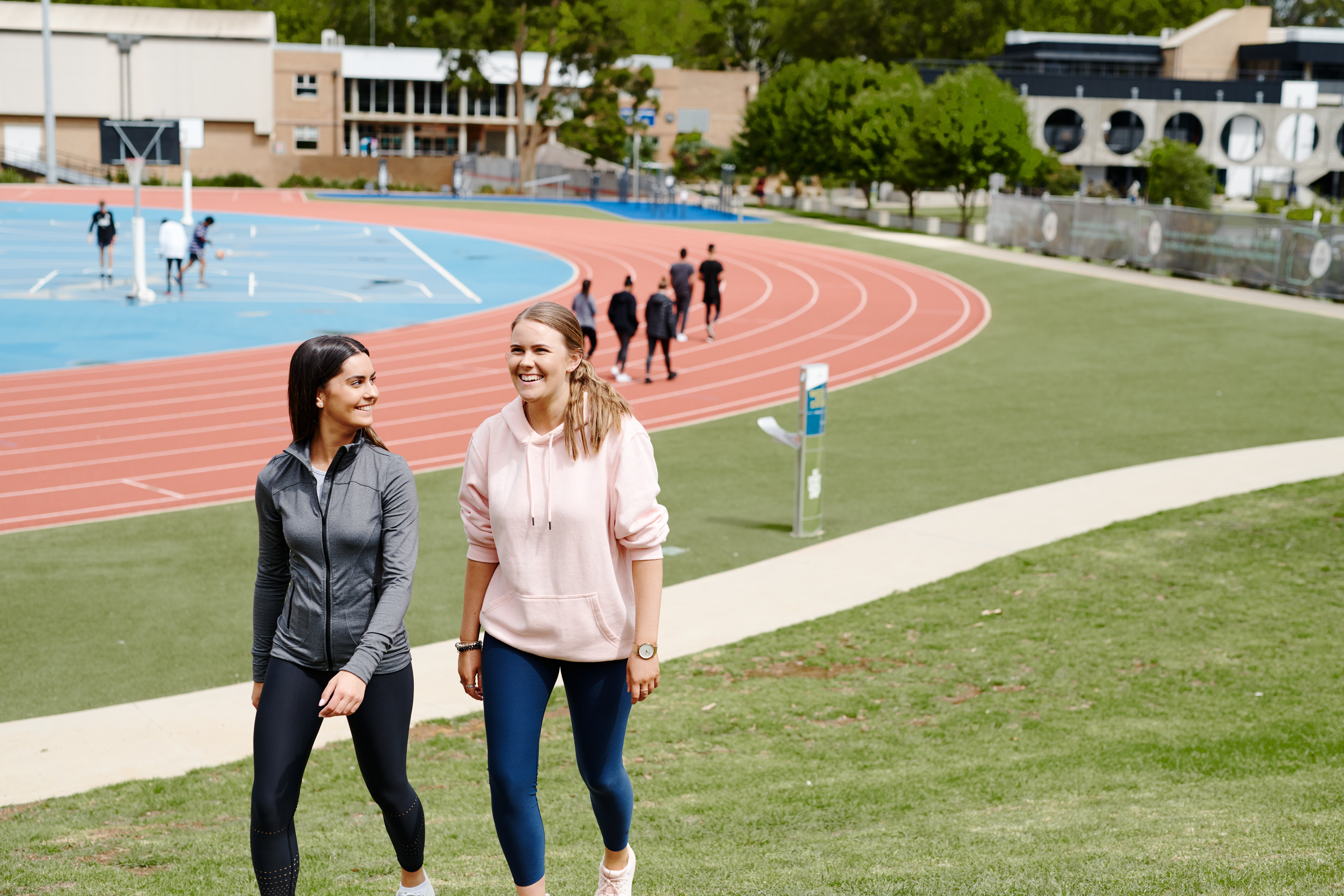Active April Two students walking near at running track at Deakin Waurn Ponds Campus
