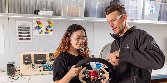A Deakin research student and her supervisor working on an engineering prototype