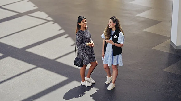 A student talking with a Deakin staff member