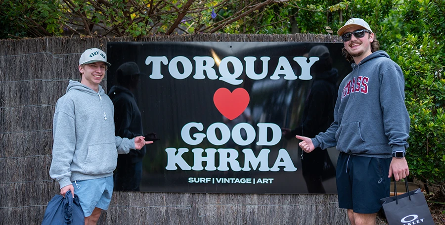 Two Summer School students visiting surf shops in Torquay after Surf Day.